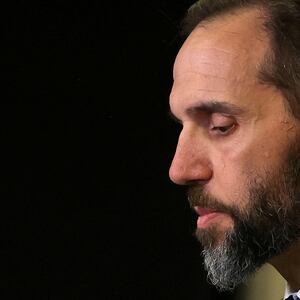 Special Counsel Jack Smith looks on as he makes a statement to reporters.