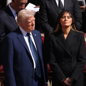 President Donald Trump and US First Lady Melania Trump standing before Pope Francis' funeral.